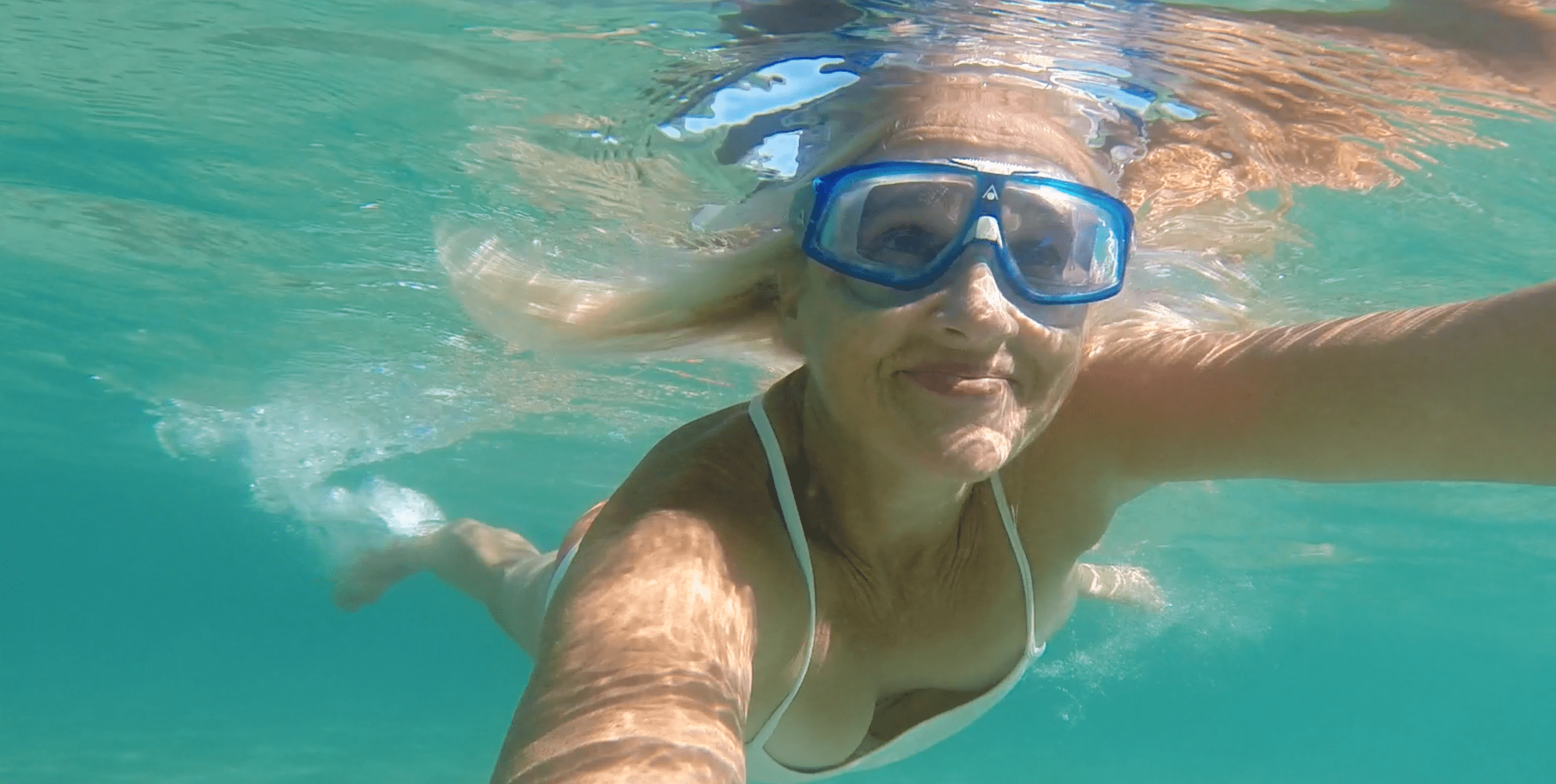 hawaii-woman-snorkeling-ocean-water
